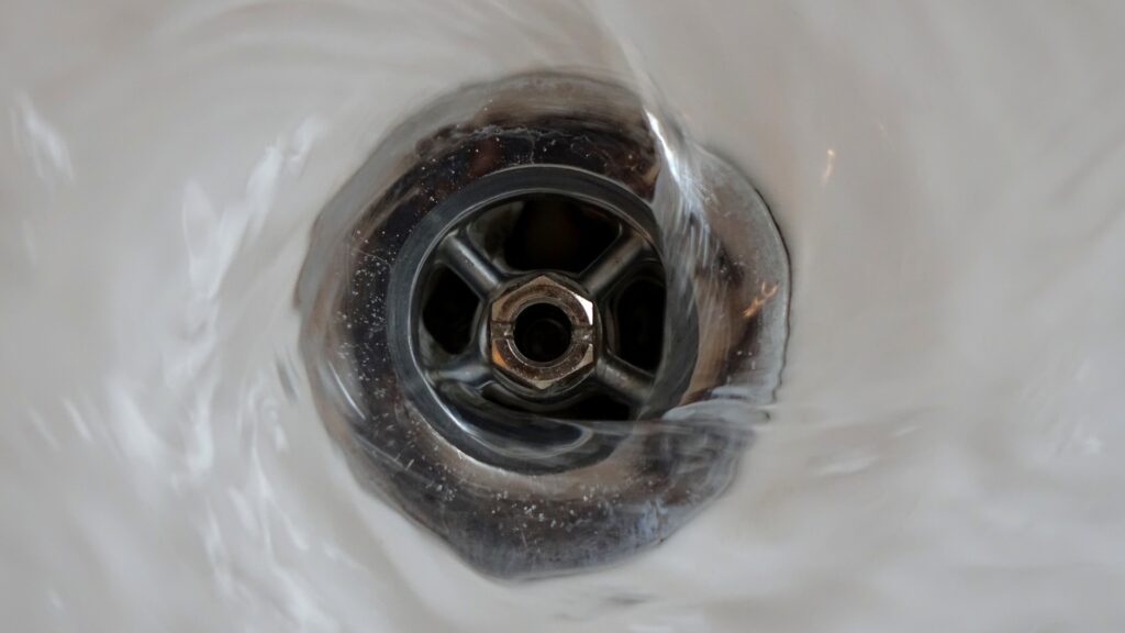 Drain cleaner safety warning signs and protective equipment for chemical exposure